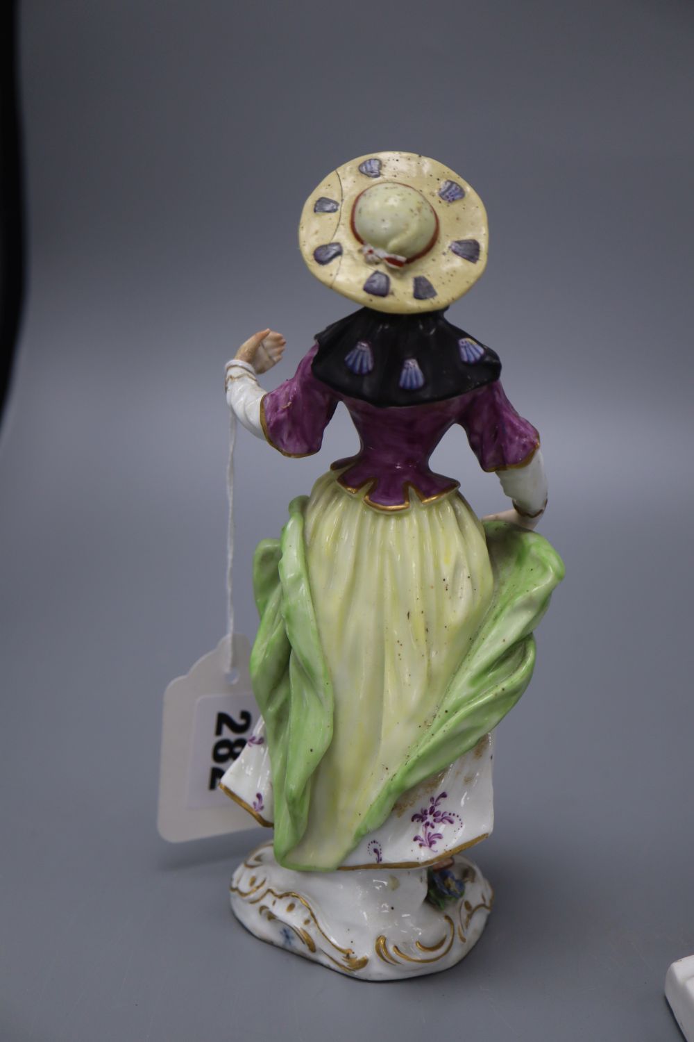 A Meissen style figure of a lady, height 19cm, and a biscuit bust of Shakespeare,